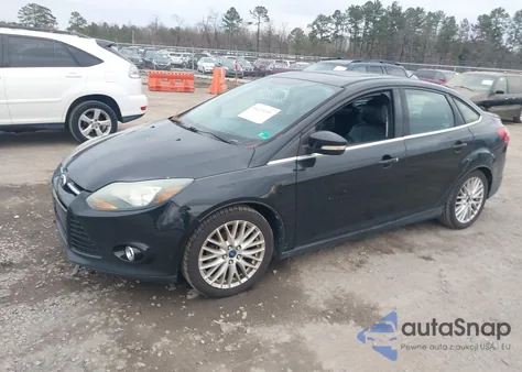 2014 Ford Focus Titanium z USA, uszkodzony, nr VIN 1FADP3J28EL134524